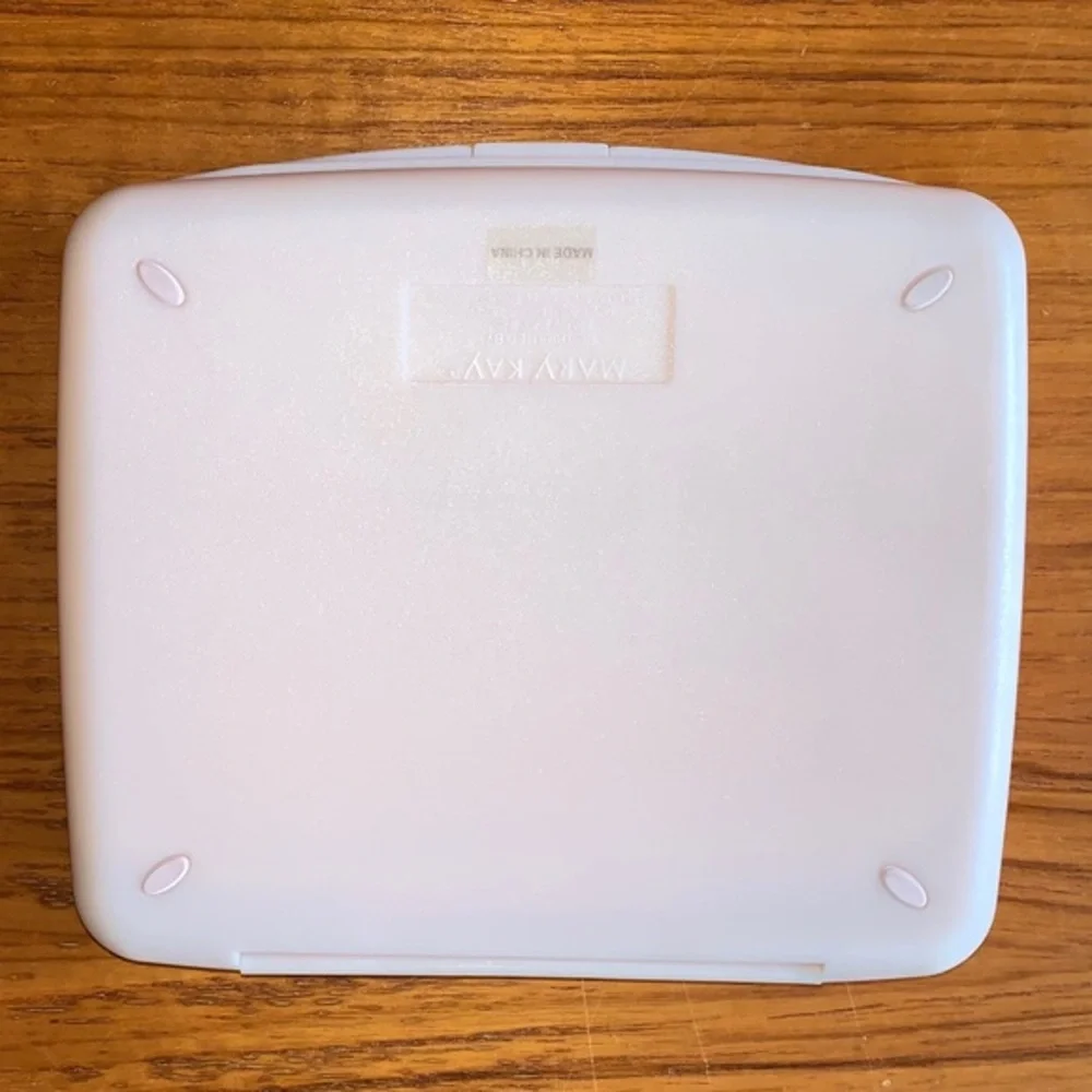 Mary Kay pink plastic compact travel mirror.